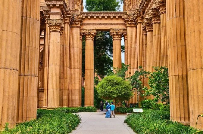 The colonnade of the Palace of Fine Arts with a garden path between the columns